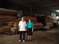 Third Brother with Wife by the sawmill where they work, Kuala Lumpur
