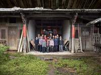 Standing in front of alter in Father's childhood home, Nan'an, Fujian, China