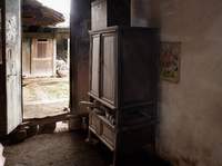 Inside Father's Childhood room - his cupboard and the earth-floored room are still as they were